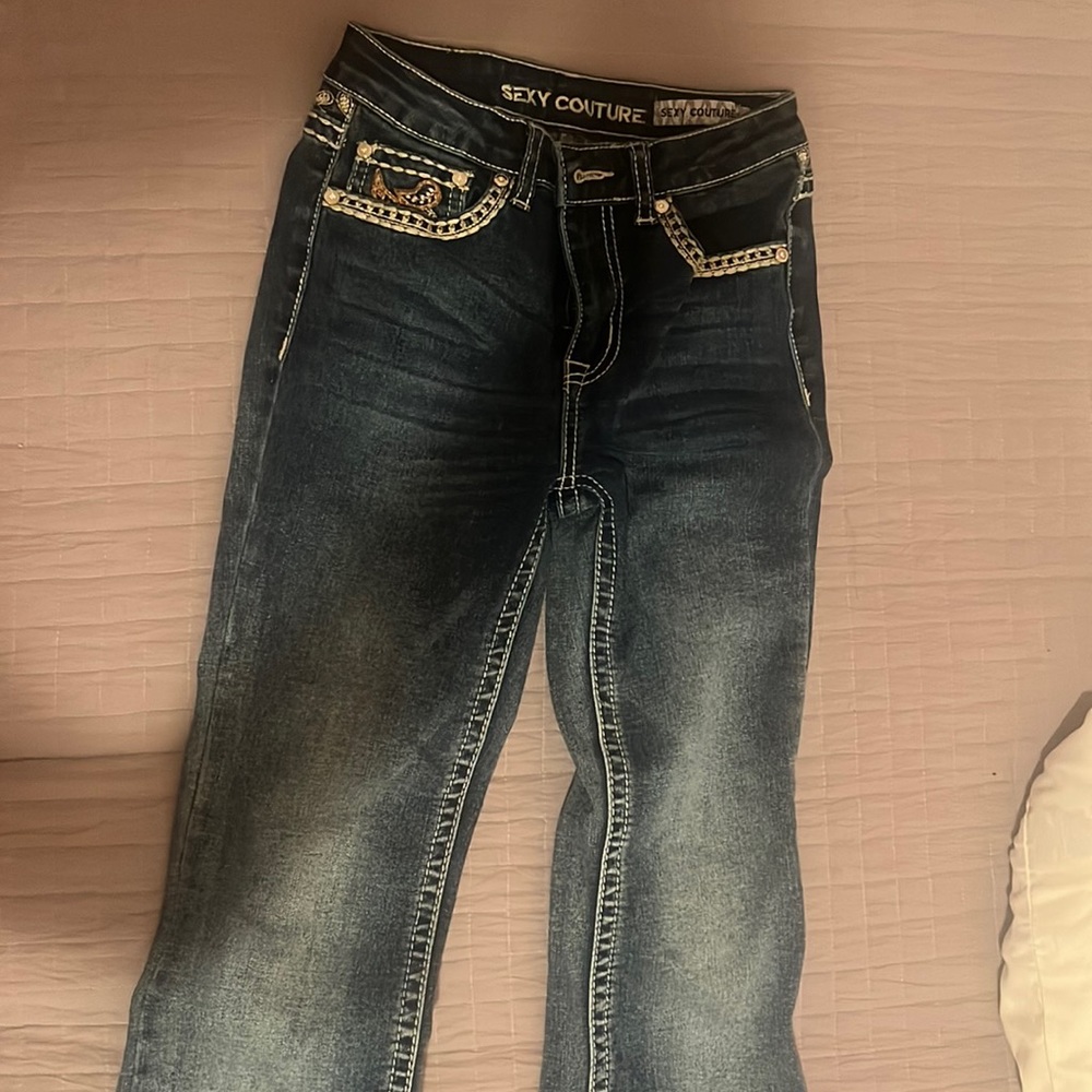 bootcut jeans with some beautiful pattern on back pockets